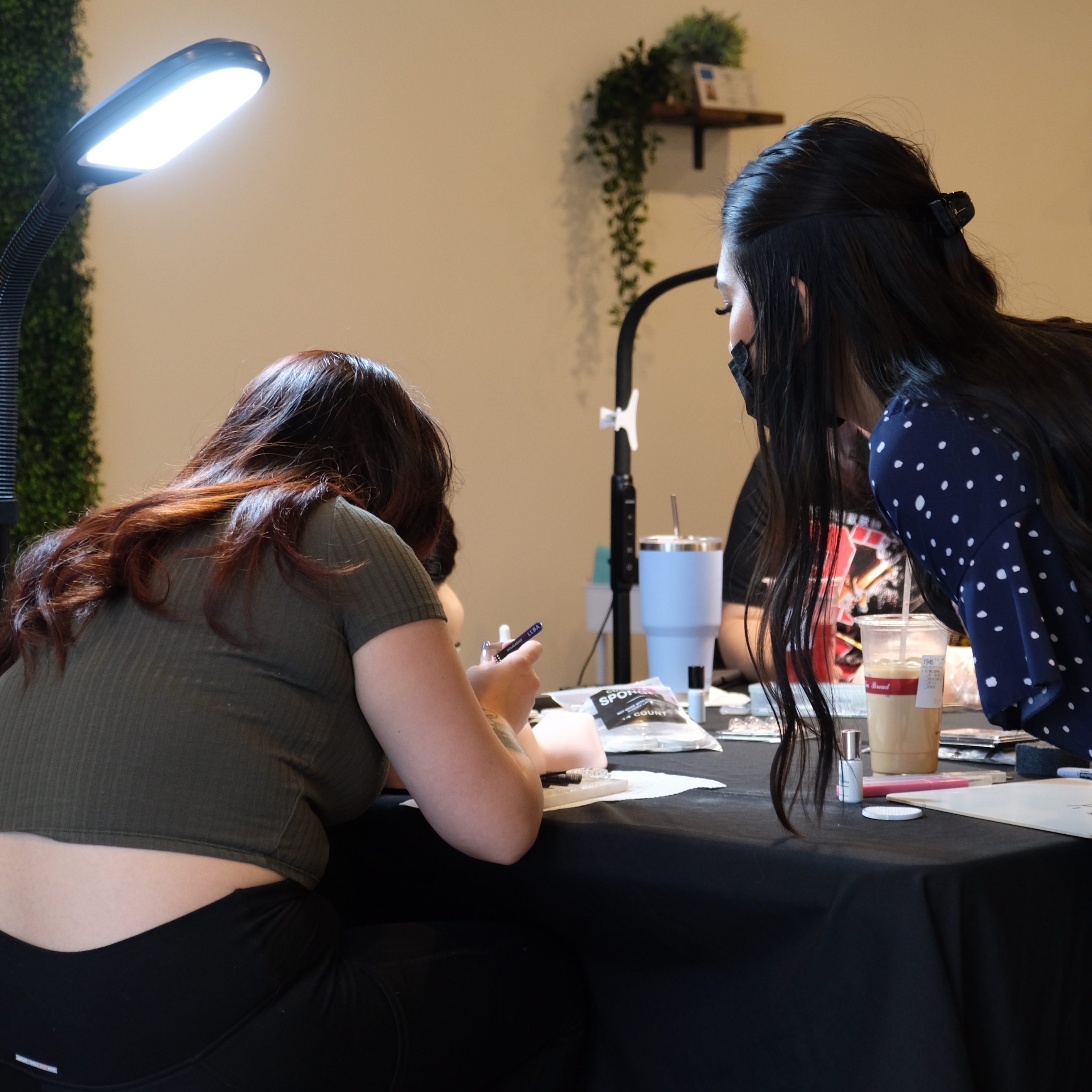 lash instructor teaching a student